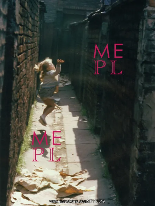 : Child playing in an alleyway : Child playing in an alleyway