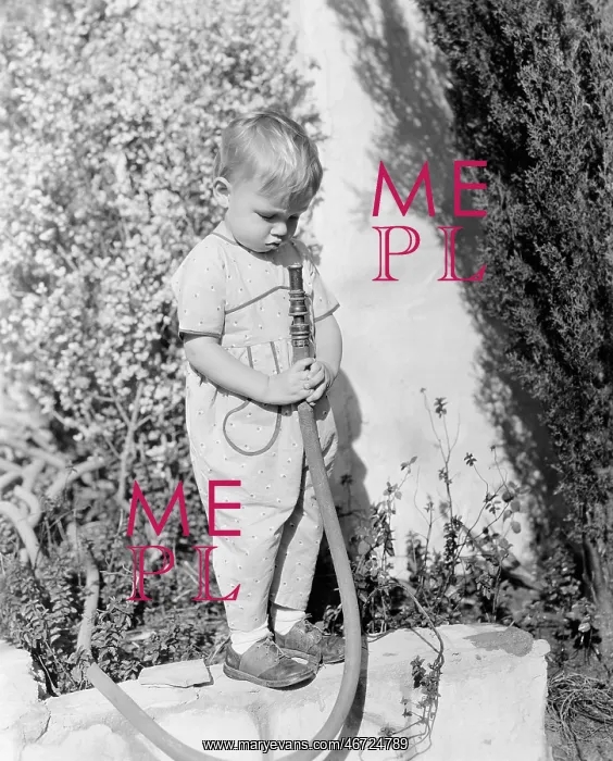 : Child pointing hose at face : Child pointing hose at face