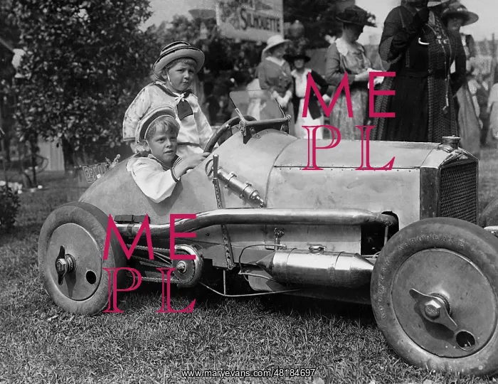 : Child in a racing car : Child in a racing car