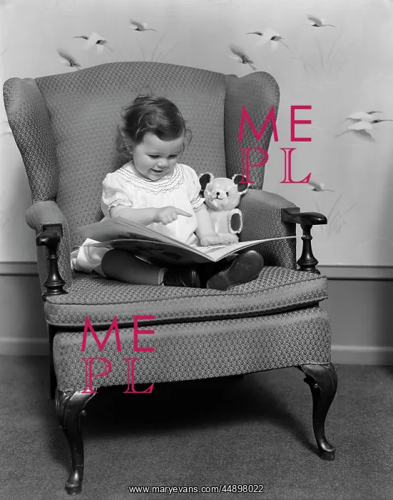  : Child Sitting On Large Chair With Bear Reading Book
