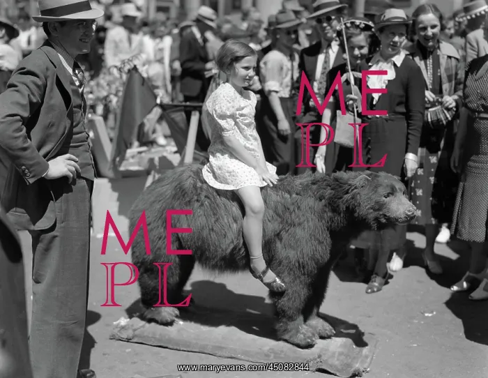 : Child Sitting on Back of Stuffed Black Bear : Child Sitting on Back of Stuffed Black Bear