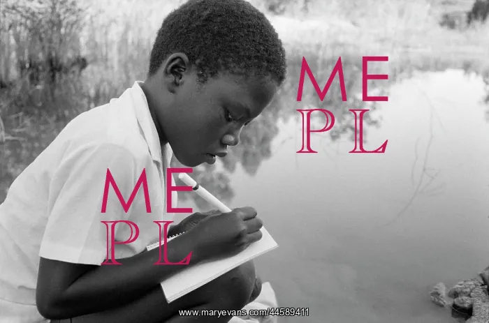 : Child from a tented camp doing his homework on : Child from a tented camp doing his homework on