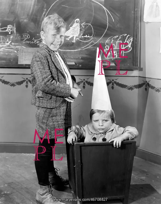 : Child wearing Dunce hat in school : Child wearing Dunce hat in school