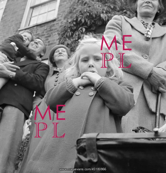 : Children. A young girl looking down with people standing behind : Children. A young girl looking down with people standing behind