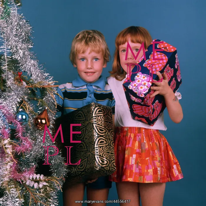 : Two Children with artificial Christmas tree and presents : Two Children with artificial Christmas tree and presents