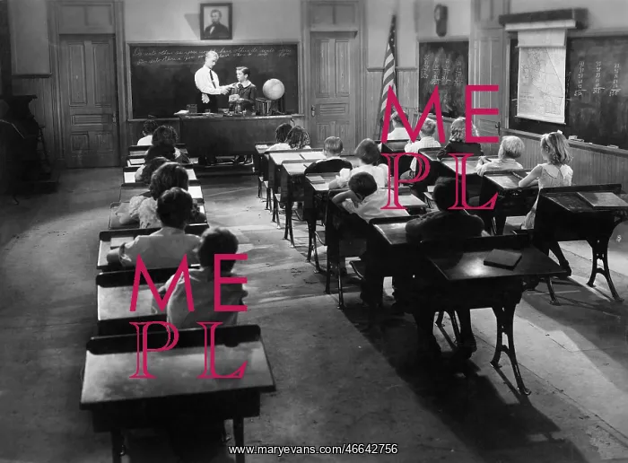 : Children in a class room with a teacher : Children in a class room with a teacher