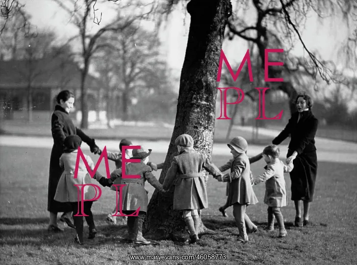 : Children dancing around a tree : Children dancing around a tree
