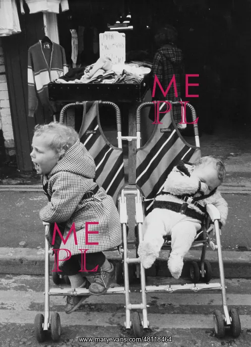 : Two children in double push chair : Two children in double push chair
