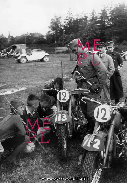 : Children are fascinated by the motorcycles, undated : Children are fascinated by the motorcycles, undated