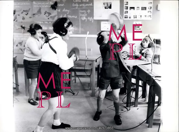 : Children with headphones during music class at school : Children with headphones during music class at school