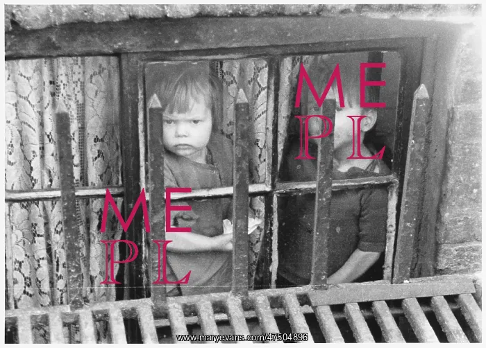 : Children look out from a Limehouse basement : Children look out from a Limehouse basement