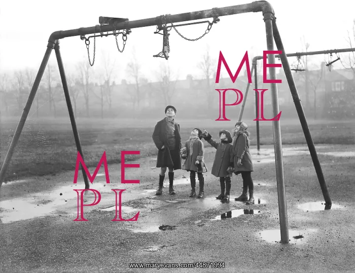 : Children looking up at tangled swings in a playground : Children looking up at tangled swings in a playground