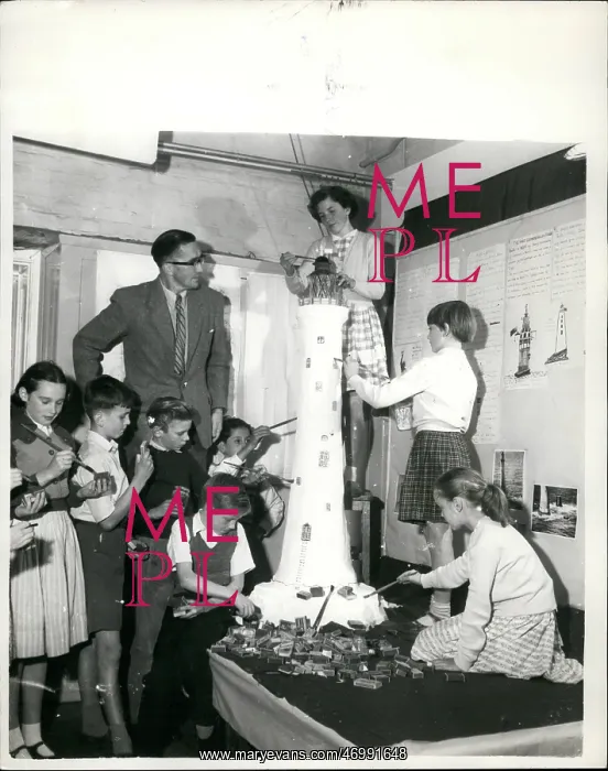 : Children making giant model lighthouse from matchboxes : Children making giant model lighthouse from matchboxes