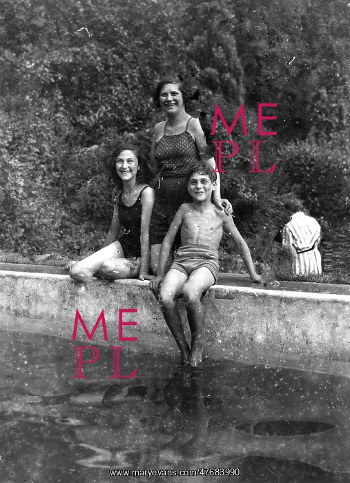 : Two children with their Mother about to go for a swim : Two children with their Mother about to go for a swim