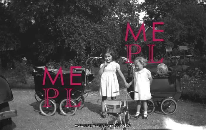  : Two children play with prams