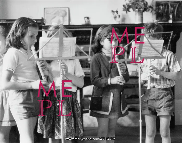 : Four children playing recorders : Four children playing recorders