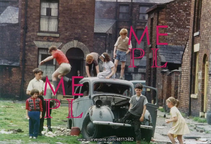 : Children playing round an old car : Children playing round an old car