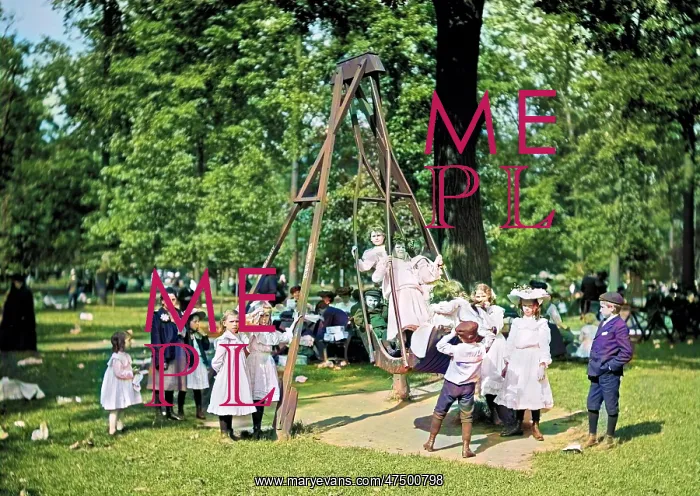 : Children playing on the swings in a park playground in Ameri : Children playing on the swings in a park playground in Ameri