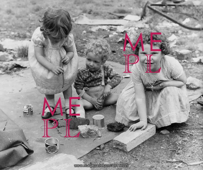 : Three children playing on waste ground : Three children playing on waste ground