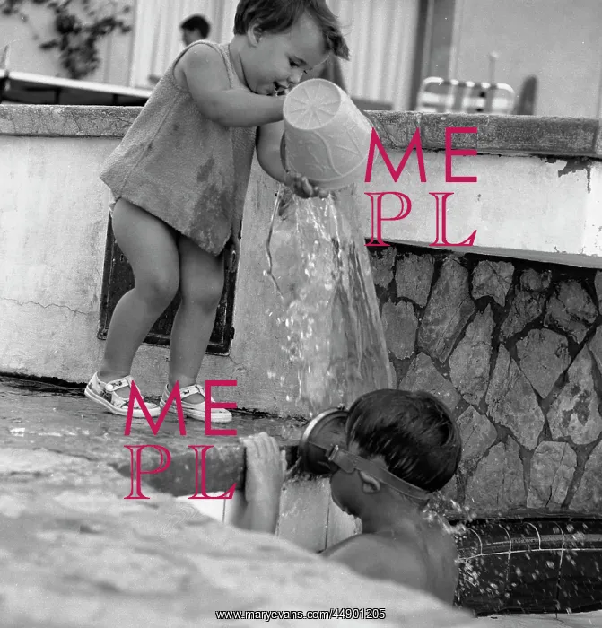 : Children playing with water on holiday : Children playing with water on holiday