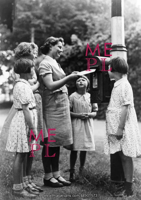: Children posting a letter : Children posting a letter