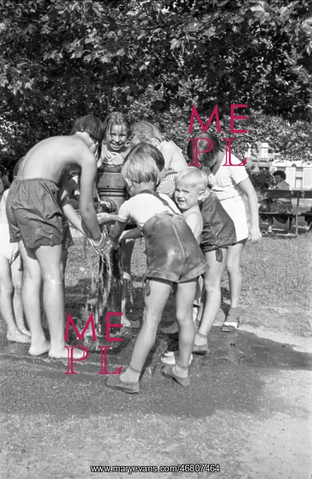: Children refresh themselves at drinking fountain : Children refresh themselves at drinking fountain