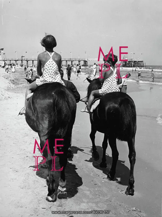 : Two children ride horses on the beach : Two children ride horses on the beach