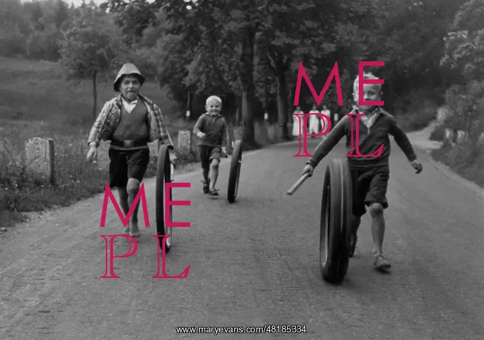 : Children rolling tires : Children rolling tires
