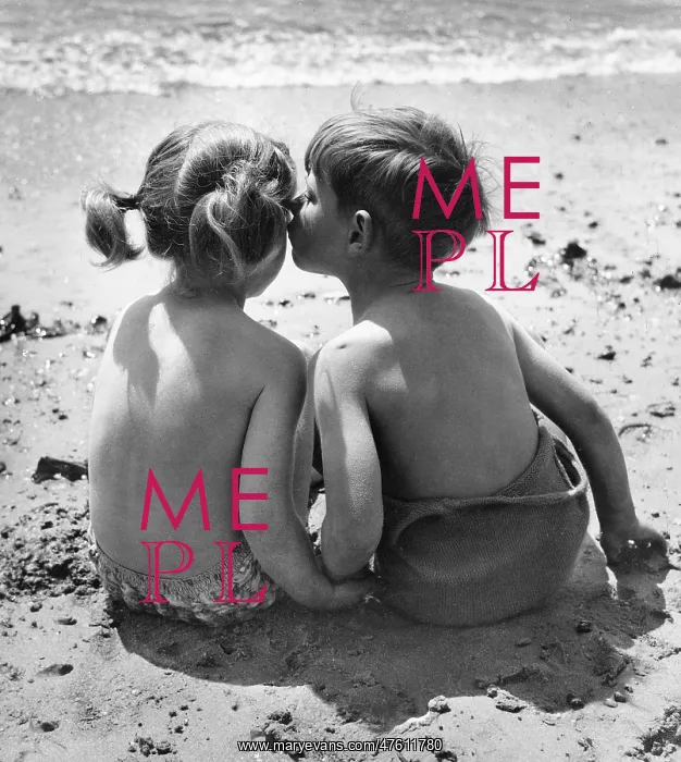 : Two children sitting on a beach : Two children sitting on a beach