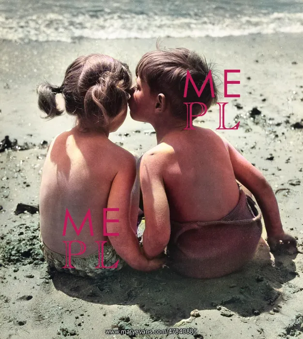 : Two children sitting on a beach : Two children sitting on a beach