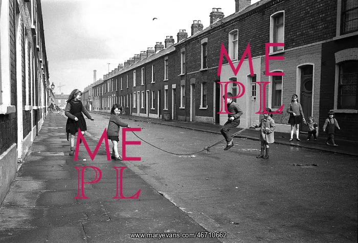 : Children skipping in a street, Belfast, Northern Ireland : Children skipping in a street, Belfast, Northern Ireland
