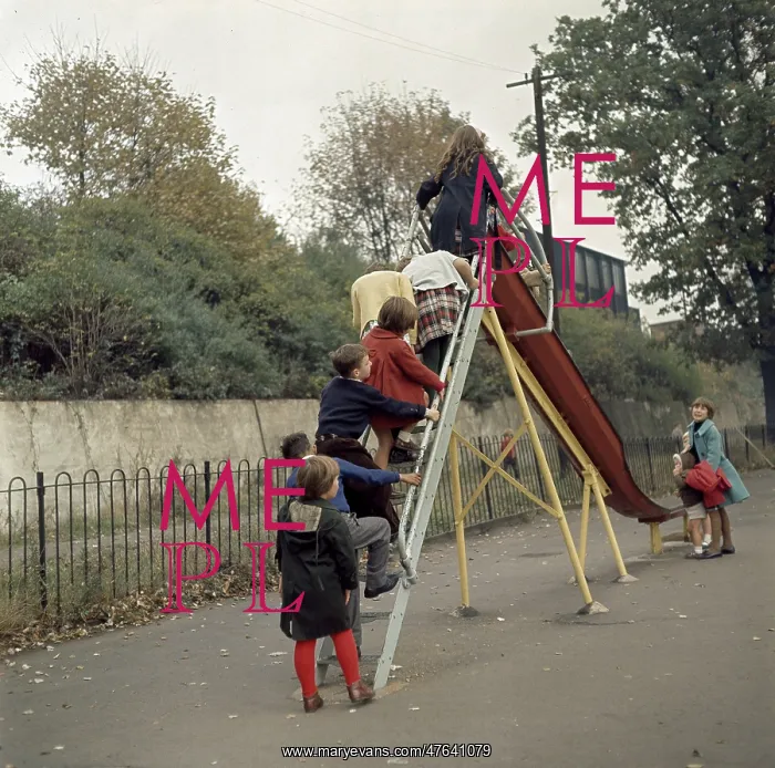  : Children on a slide in a park