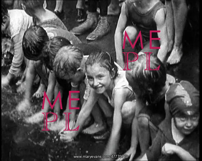 : Children Splashing In Water in the Gutter During : Children Splashing In Water in the Gutter During