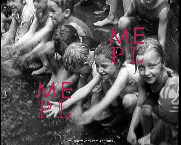 : Children Splashing In Water in the Gutter During : Children Splashing In Water in the Gutter During