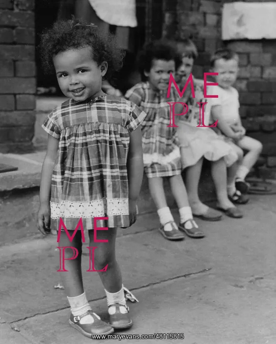 : Four children on a street : Four children on a street