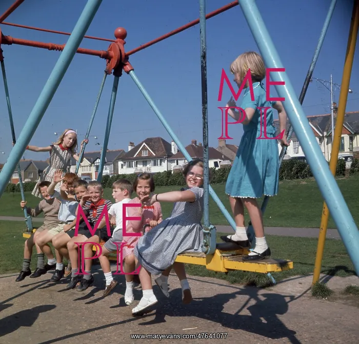  : Children on a swing in a park