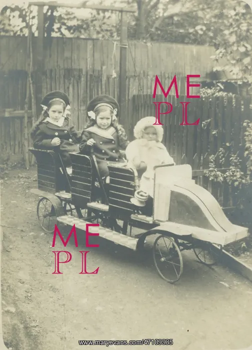: Children in a toy car : Children in a toy car