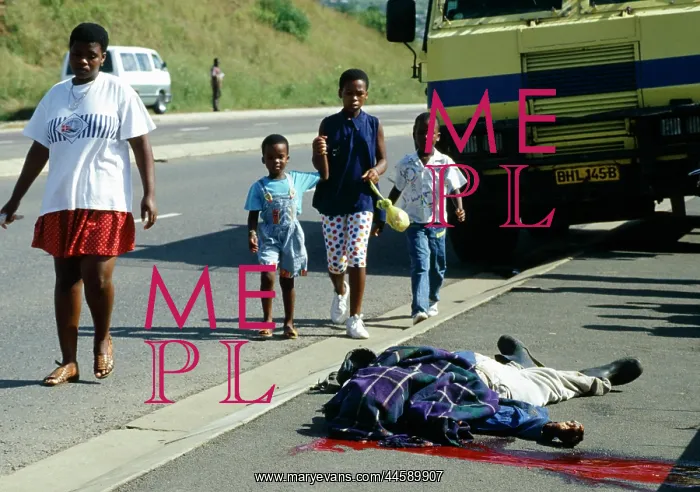 : Children walk along the road past a dead, blanket-covered : Children walk along the road past a dead, blanket-covered