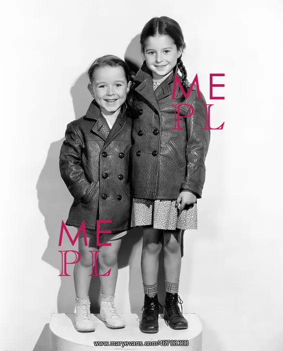 : Two children wearing jackets : Two children wearing jackets