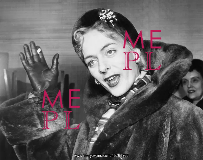 : Christine Jorgensen, waves to photographers, upon : Christine Jorgensen, waves to photographers, upon