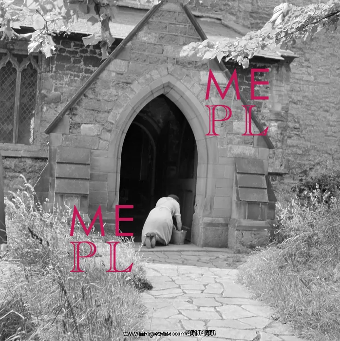 : Church. Rear view of a woman with a bucket kneeling down : Church. Rear view of a woman with a bucket kneeling down