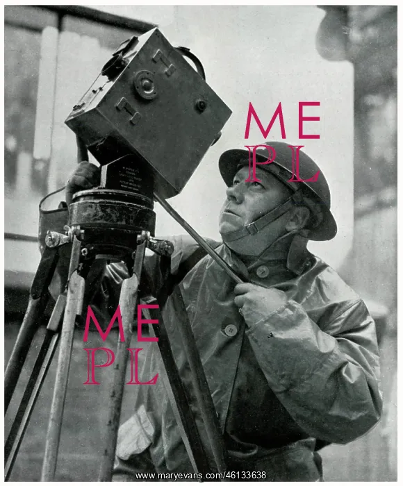 : Cinematographer adjusts his camera, September 1939 : Cinematographer adjusts his camera, September 1939