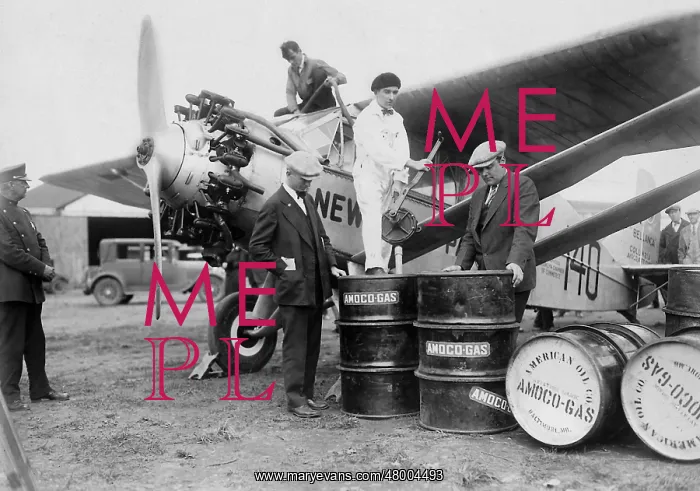 : Clarence Chamberlain and Lloyd Bertaud refuel their Columbi : Clarence Chamberlain and Lloyd Bertaud refuel their Columbi