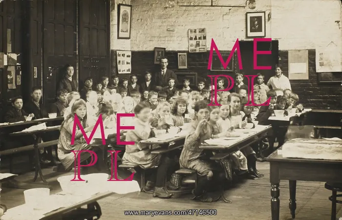: Classroom scene, with pupils eating at their desks : Classroom scene, with pupils eating at their desks