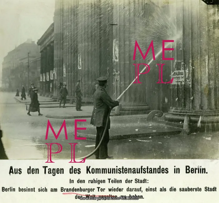 : Cleaning up at the Brandenburg Gate after street fights : Cleaning up at the Brandenburg Gate after street fights