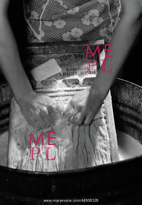  : Close-up of woman's hands scrubbing clothes on
