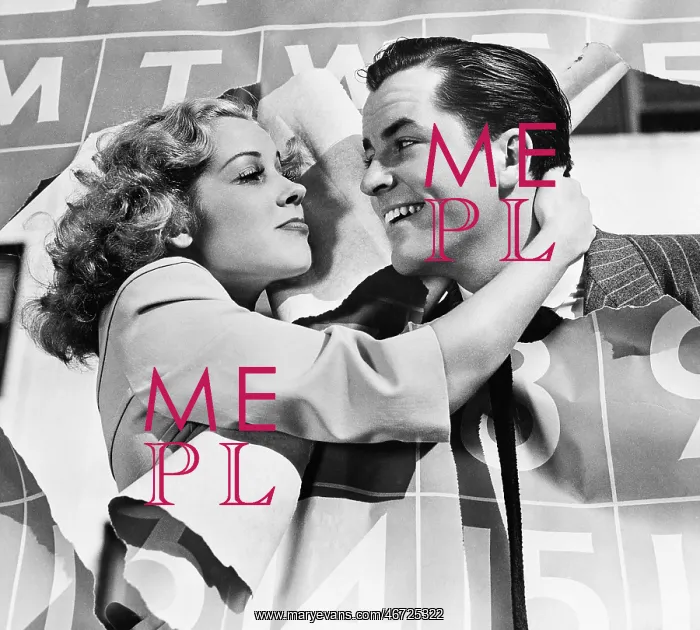 : Closeup of couple bursting through calendar : Closeup of couple bursting through calendar