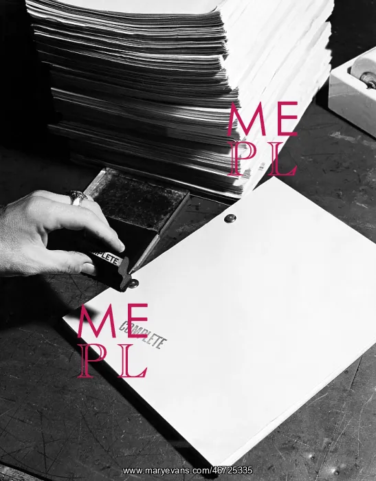 : Closeup of hand stamping movie script : Closeup of hand stamping movie script