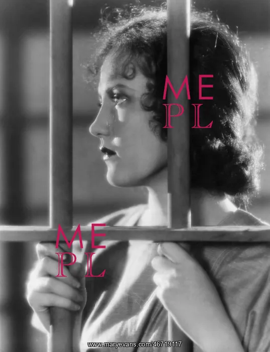 : Closeup of woman behind bars : Closeup of woman behind bars