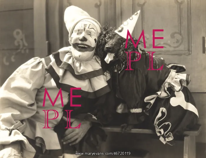 : Clown posing with dog dressed in clown costume : Clown posing with dog dressed in clown costume